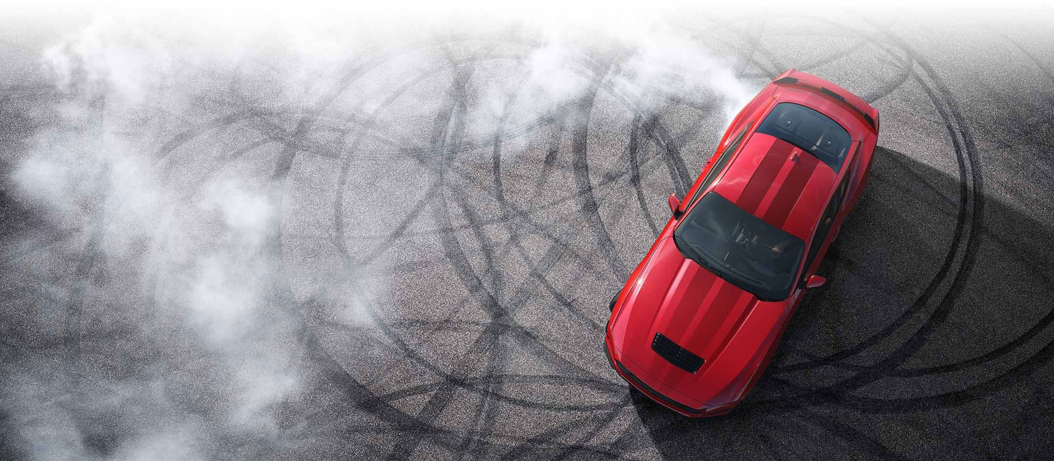 Overhead view of a 2024 Ford Mustang® model with tire tracks on pavement | Bob Sight Ford Inc in Lees Summit MO